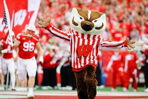 UW mascot Bucky Badger leads the team onto the field at the beginning of a game against the Purdue Boilermakers at Camp Randall Stadium at the University of Wisconsin-Madison on Sept. 21, 2013. The Badgers won the game 41-10. (Photo by Bryce Richter / UW-Madison)