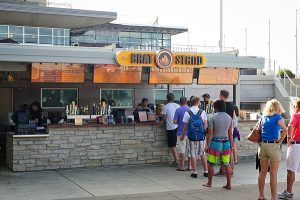 UW students and members of the Madison community enjoy a cool summer evening near the Memorial Union Terrace Brat Stand on Lake Mendota at the University of Wisconsin-Madison on July 29, 2013.  (Photo by Bryce Richter/UW-Madison)