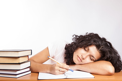 Women napping while studying.
